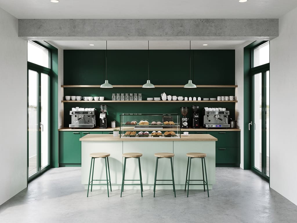 Interno di una piccola caffetteria italiana con banco, sedute e vetrina dei dolci